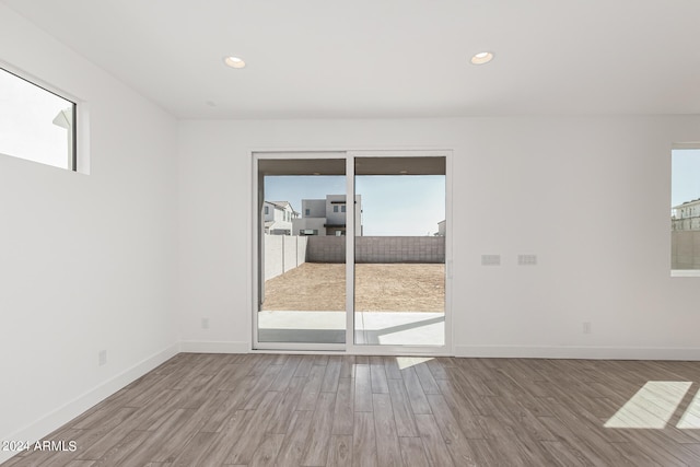 empty room featuring hardwood / wood-style flooring