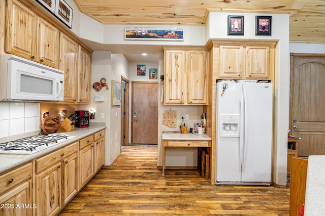 420 N Retreat Dr, Show Low, AZ 85901 - kitchen featuring white appliances, wood finished floors, light brown cabinets, light countertops, and wooden ceiling