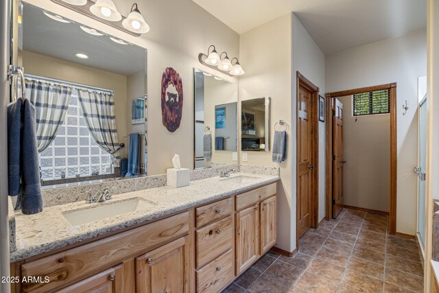 420 N Retreat Dr, Show Low, AZ 85901 - bathroom featuring double vanity and baseboards
