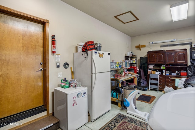 420 N Retreat Dr, Show Low, AZ 85901 - kitchen with refrigerator, freestanding refrigerator, and dark brown cabinets
