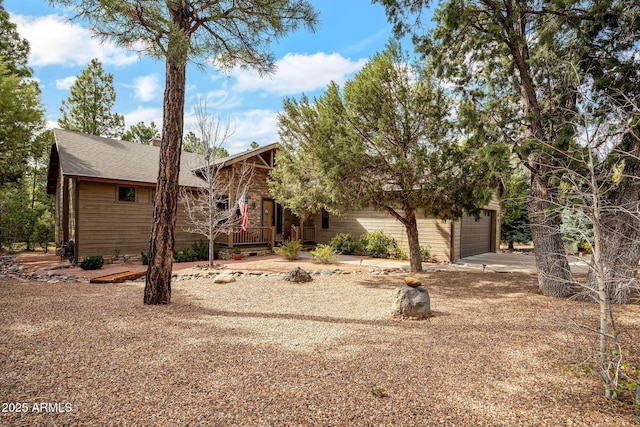 420 N Retreat Dr, Show Low, AZ 85901 - view of front of house featuring an attached garage, driveway, and a shingled roof