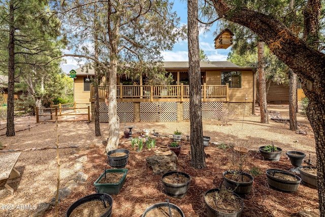 420 N Retreat Dr, Show Low, AZ 85901 - view of front of house with a wooden deck and roof with shingles
