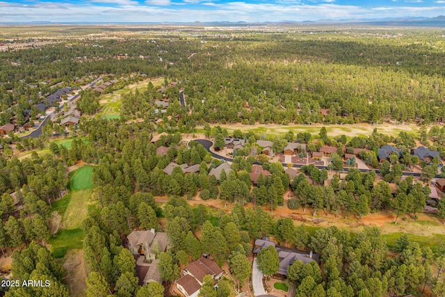 420 N Retreat Dr, Show Low, AZ 85901 - aerial view of property's location with a heavily wooded area, a mountain backdrop, and nearby suburban area