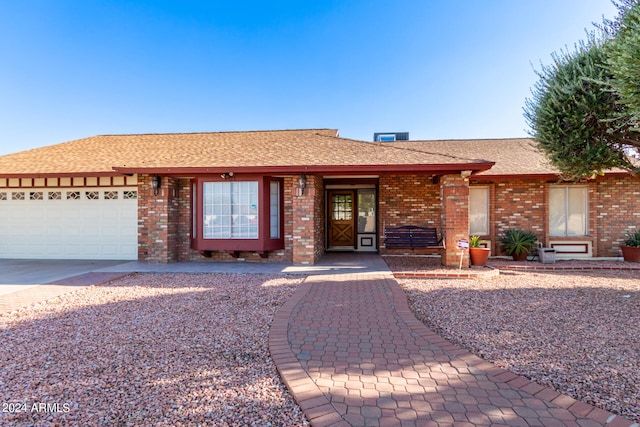 ranch-style house featuring a garage