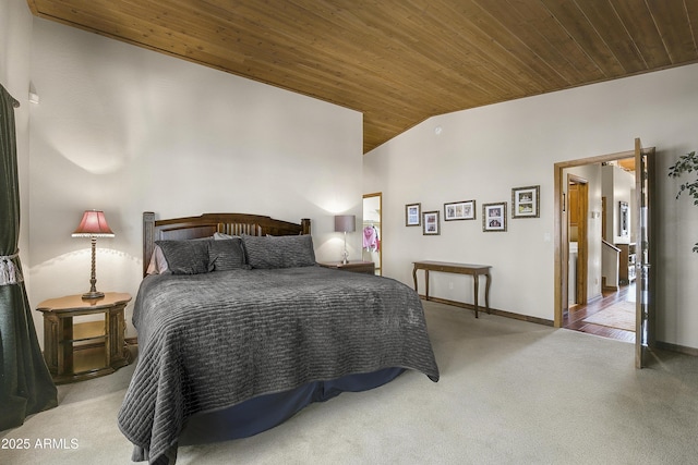 carpeted bedroom with wooden ceiling, vaulted ceiling, and baseboards