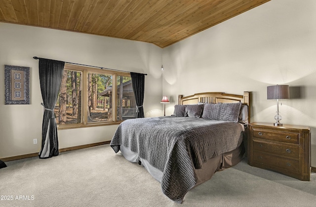 carpeted bedroom featuring wood ceiling and baseboards