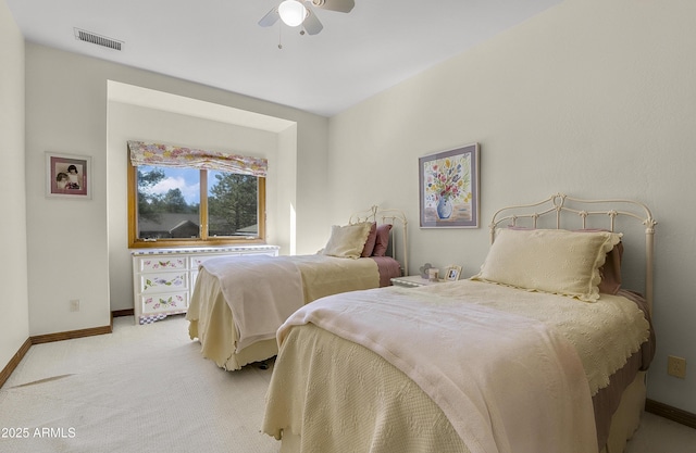 bedroom featuring baseboards, light carpet, and a ceiling fan