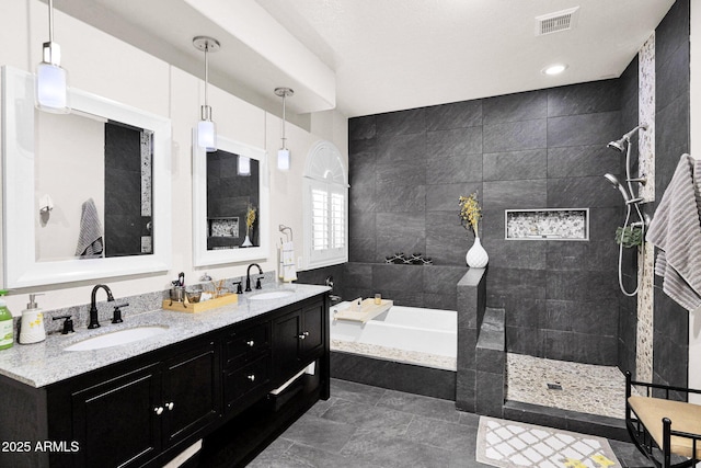 bathroom featuring vanity and separate shower and tub