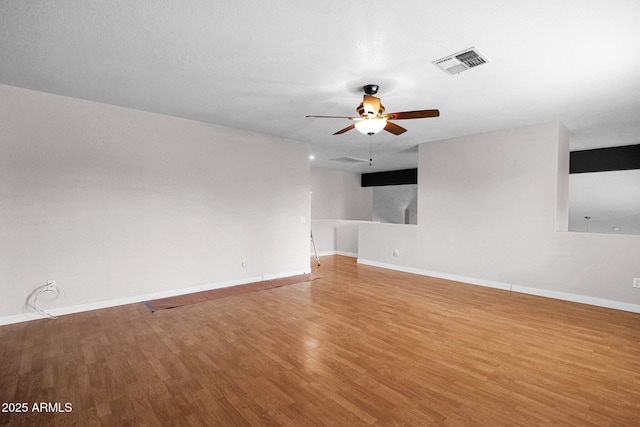 unfurnished room featuring ceiling fan and wood-type flooring