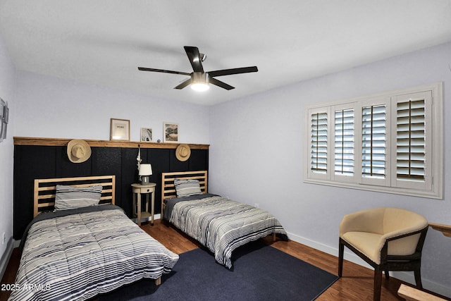 bedroom featuring hardwood / wood-style floors and ceiling fan