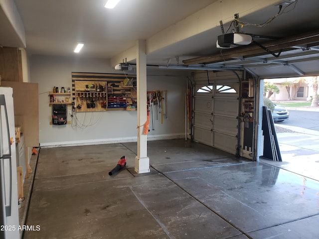 garage featuring a garage door opener and fridge