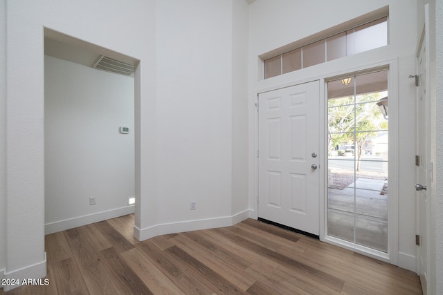 entryway with hardwood / wood-style flooring