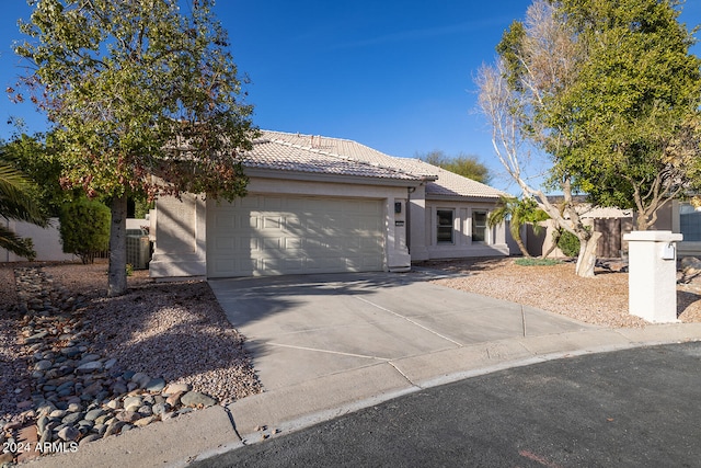 single story home with a garage