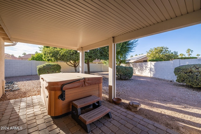 view of patio / terrace featuring a hot tub