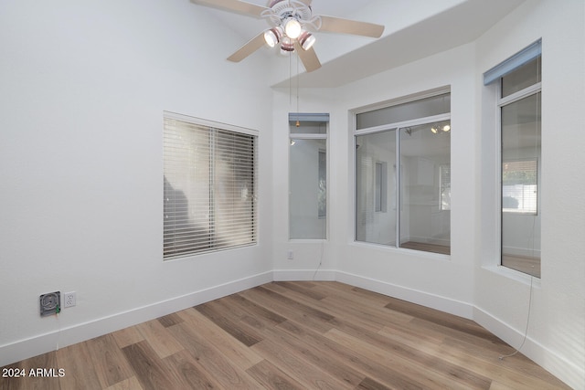 unfurnished room with ceiling fan and light hardwood / wood-style floors