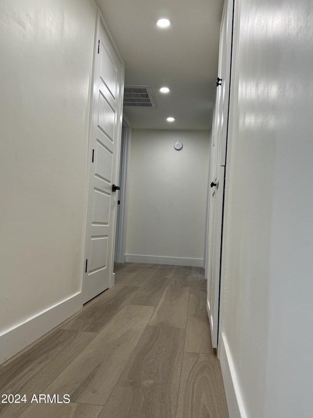 hallway featuring light hardwood / wood-style flooring