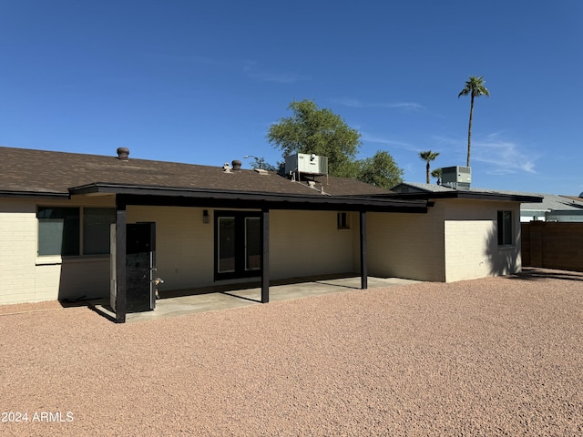 back of house featuring cooling unit and a patio area