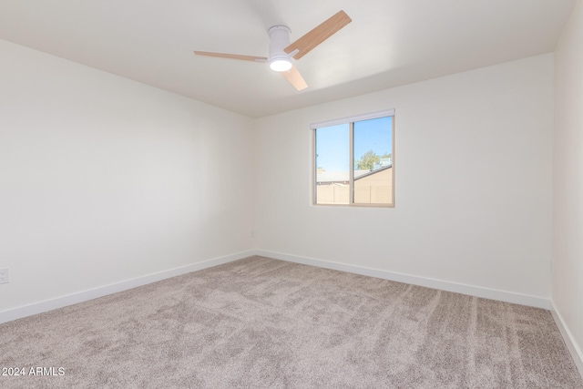 unfurnished room featuring ceiling fan and carpet floors