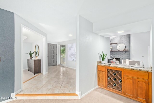 18585 N 70th Ave, Glendale, AZ 85308 - bar with light tile patterned floors, baseboards, a sink, and wine cooler