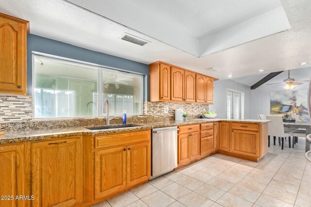 18585 N 70th Ave, Glendale, AZ 85308 - kitchen with light stone countertops, a peninsula, visible vents, dishwasher, and a sink