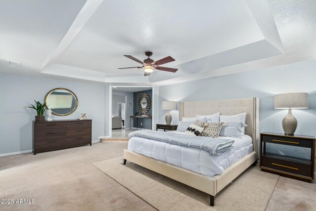 18585 N 70th Ave, Glendale, AZ 85308 - bedroom featuring a tray ceiling, carpet flooring, baseboards, and visible vents