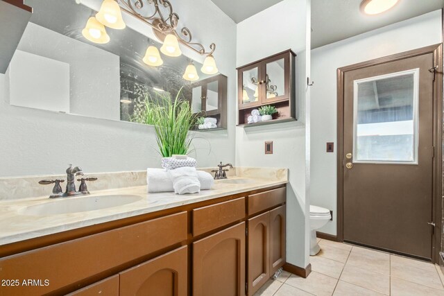18585 N 70th Ave, Glendale, AZ 85308 - bathroom featuring toilet, double vanity, a sink, and tile patterned flooring