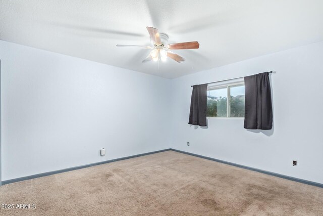18585 N 70th Ave, Glendale, AZ 85308 - spare room featuring ceiling fan, carpet flooring, and baseboards