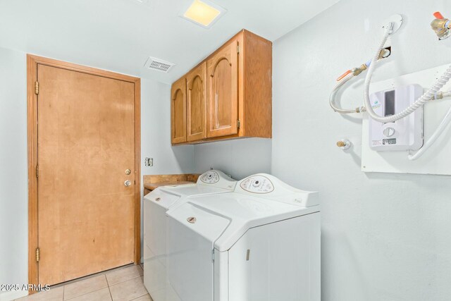 18585 N 70th Ave, Glendale, AZ 85308 - laundry area featuring cabinet space, visible vents, separate washer and dryer, and light tile patterned floors