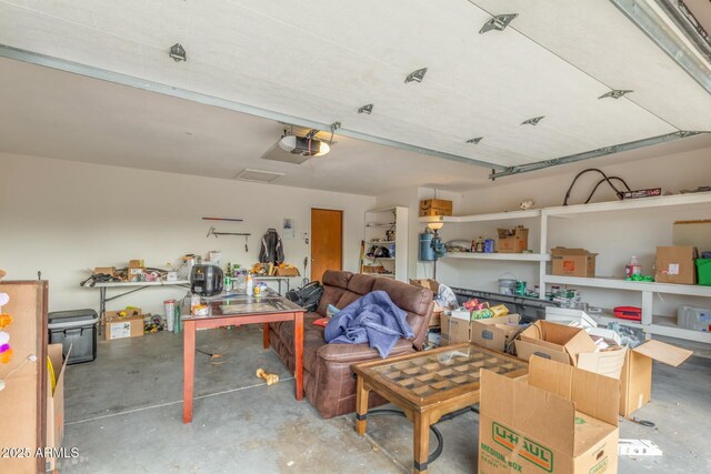 18585 N 70th Ave, Glendale, AZ 85308 - garage featuring a garage door opener and a workshop area