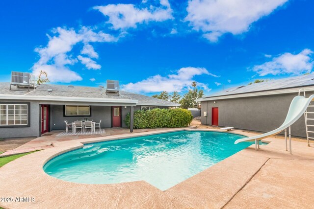 18585 N 70th Ave, Glendale, AZ 85308 - pool featuring outdoor dining space, a patio, central AC, and a diving board