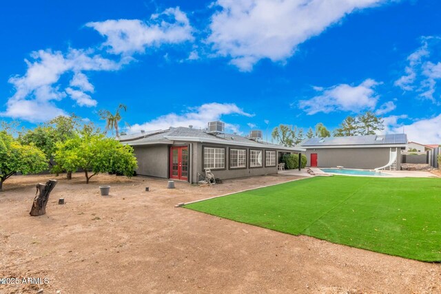 18585 N 70th Ave, Glendale, AZ 85308 - back of house featuring a patio area, french doors, central AC unit, and roof mounted solar panels