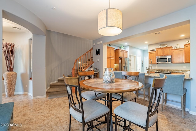 dining room featuring sink