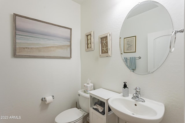 bathroom with sink and toilet