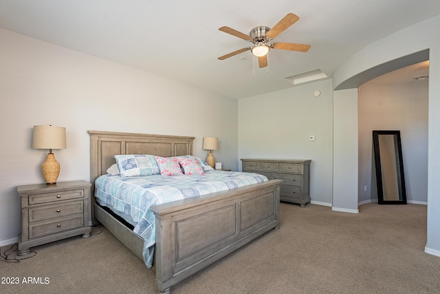 bedroom featuring ceiling fan and light colored carpet