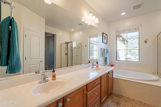 bathroom featuring vanity, shower with separate bathtub, and tile patterned flooring