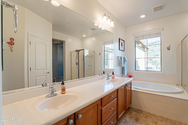 bathroom featuring vanity, tile patterned flooring, and independent shower and bath