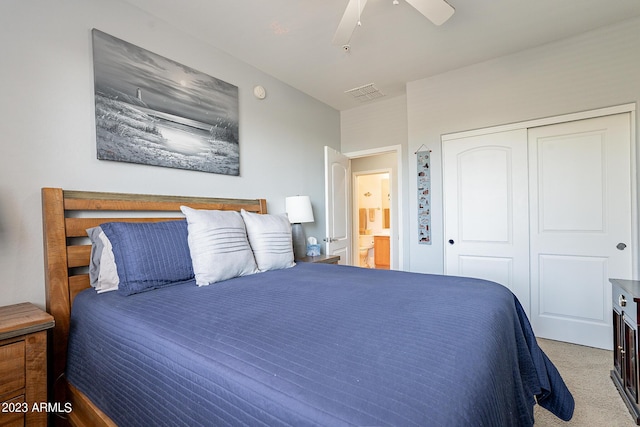 bedroom featuring ceiling fan, a closet, and light carpet