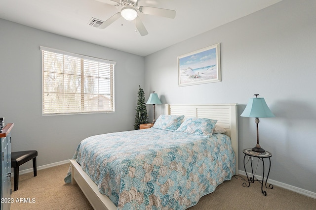 bedroom featuring ceiling fan and light colored carpet