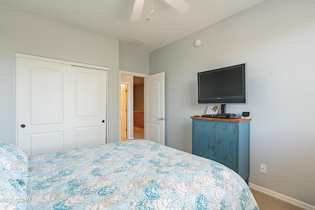 bedroom with carpet floors, a closet, and ceiling fan