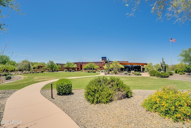 view of property's community with a lawn