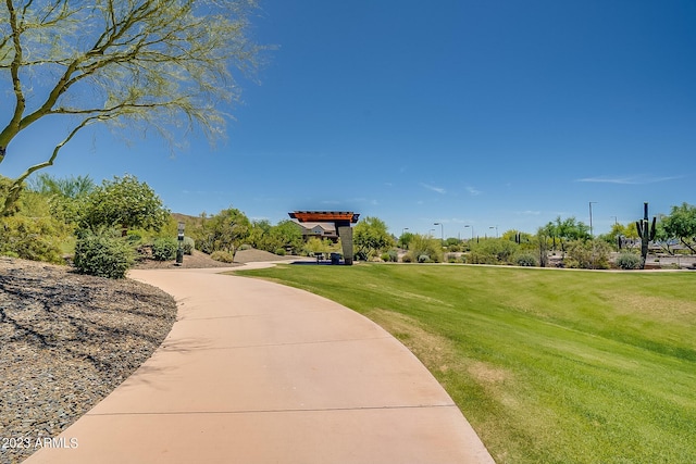 view of property's community with a lawn