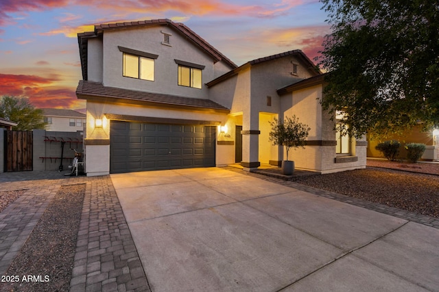 2533 W Novak Way, Phoenix, AZ 85041 - view of front of property with stucco siding, a garage, driveway, a tile roof, and fence