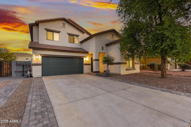2533 W Novak Way, Phoenix, AZ 85041 - traditional-style house featuring stucco siding, an attached garage, concrete driveway, a tiled roof, and fence