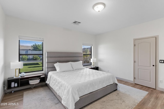 2533 W Novak Way, Phoenix, AZ 85041 - bedroom featuring wood finished floors and baseboards