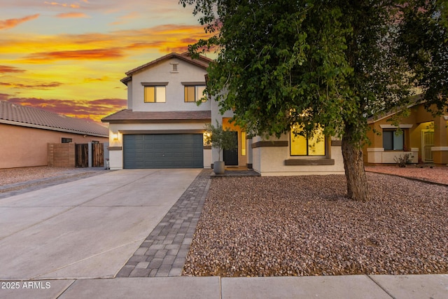 2533 W Novak Way, Phoenix, AZ 85041 - view of front of home with stucco siding, concrete driveway, and an attached garage