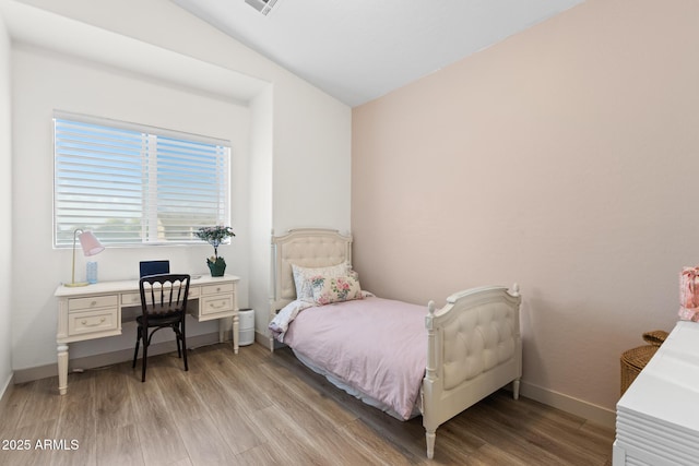 2533 W Novak Way, Phoenix, AZ 85041 - bedroom with light wood finished floors, lofted ceiling, and baseboards