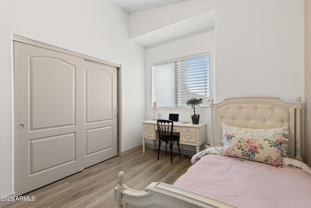 2533 W Novak Way, Phoenix, AZ 85041 - bedroom featuring light wood-style flooring, a closet, and baseboards