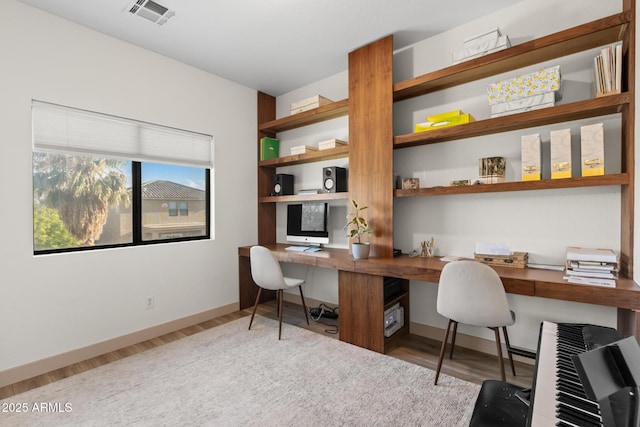 2533 W Novak Way, Phoenix, AZ 85041 - office space with built in study area, wood finished floors, and baseboards