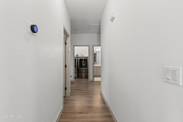 2533 W Novak Way, Phoenix, AZ 85041 - corridor with washer / clothes dryer, wood finished floors, and baseboards