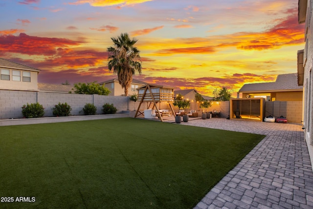 2533 W Novak Way, Phoenix, AZ 85041 - yard at dusk with a playground and a patio